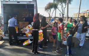 AUHS students, staff and faculty giving a free turkey to a family in need.